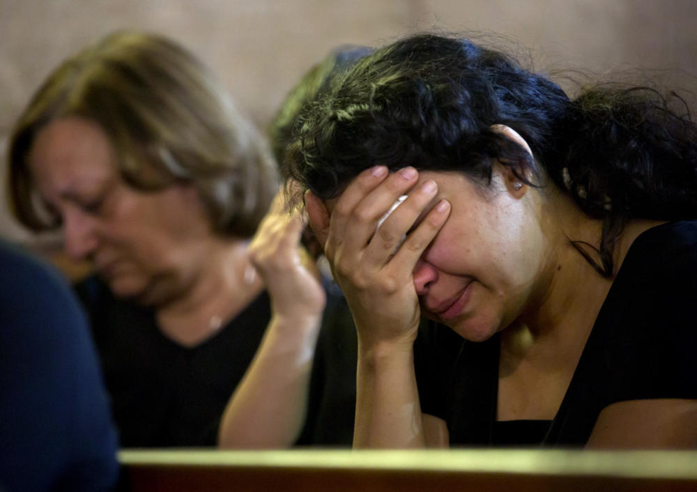 Coptic Christians grieve during prayers for the departed remembering the victims of Egypt Air flight 804 at Al Boutrossiya Church in Cairo Egypt on Sunday