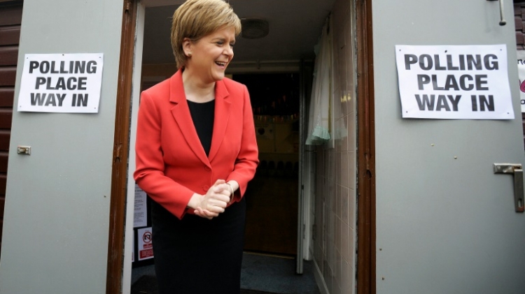 Scotland's First Minister and Leader of the Scottish National Party Nicola Sturgeon leaves a polling station in east Glasgow