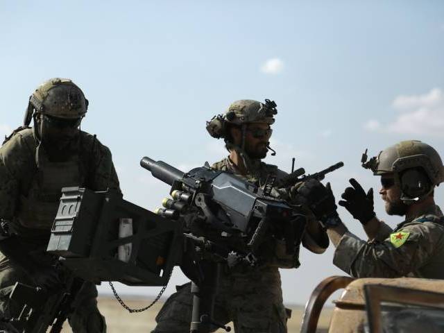 25 2016 shows men in uniform identified by Syrian Democratic forces as US special operations forces as they ride in the back of a pickup truck in the village of Fatisah in the northern Syrian province of Raqa. US special ope