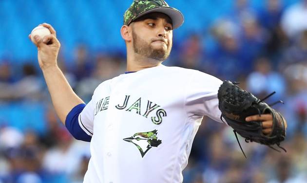 Toronto Blue Jays starting pitcher Marco Estrada throws against the New York Yankees during the first inning of a baseball game in Toronto on Monday