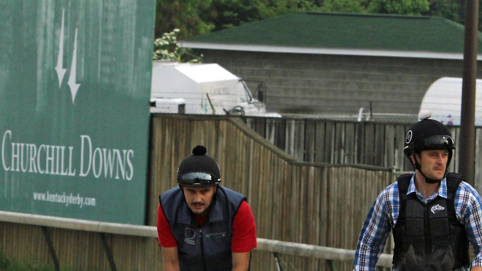 Kentucky Derby hopeful Nyquist with exercise rider Jonny Garcia in the saddle walks the wrong way on the track at Churchill Downs in Louisville Ky. Sunday