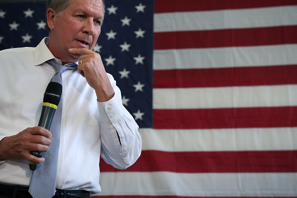 Republican presidential candidate and Ohio Governor John Kasich pauses during a campaign event