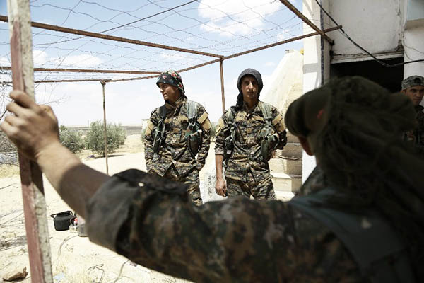 Fighters of the Kurdish People’s Protection Units. Delil Souleiman—AFP