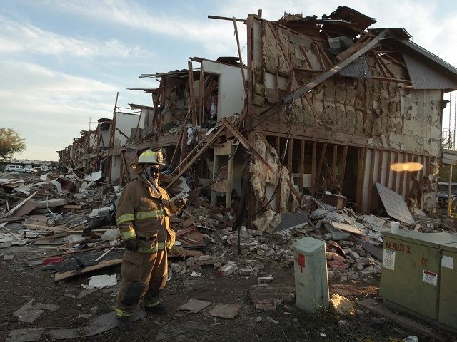 WEST TX- APRIL 18 A Valley Mills Fire Department personnel walks among the remains of an apartment complex next to the fertilizer plant that exploded yesterday afternoon