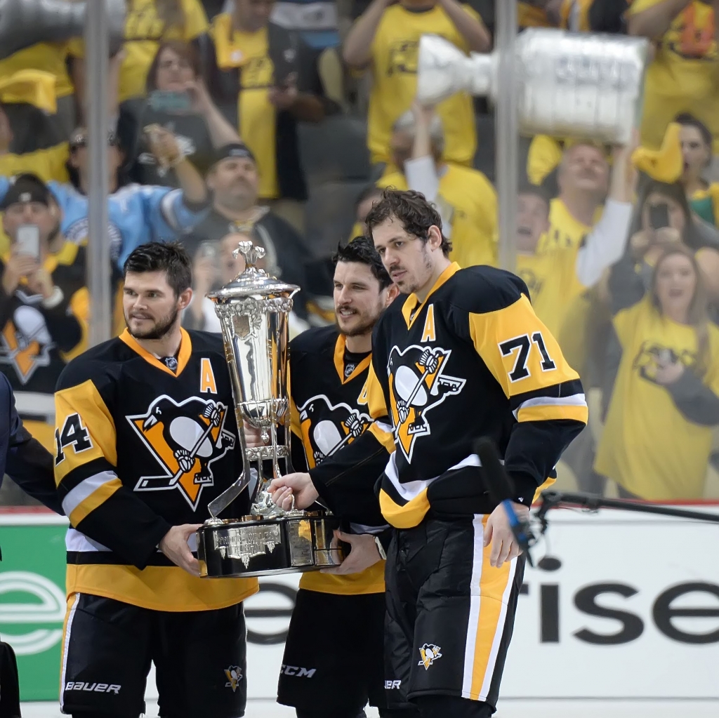 20160526pdPenguinsSports13 Penguins left wing Chris Kunitz left pose Eastern Conference trophy at the Consol Energy Center Pittsburgh Pa. Sidney Crosby with Evgeni Malkin and