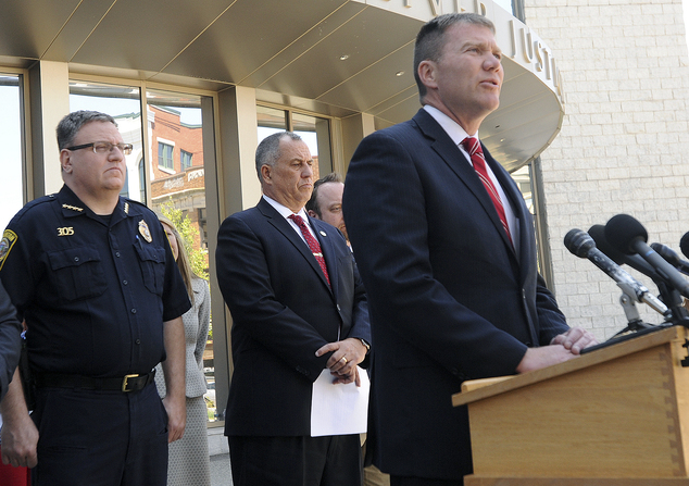 Taunton Mass. Mayor Thomas Hoye Jr. right speaks about Tuesday's stabbings at a Taunton home and shopping mall Wednesday