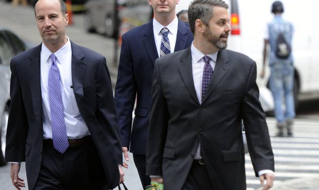 From left attorney Marc Zayon Baltimore Police Officer Edward Nero and attorney Jason Silverstein walk to Courthouse East before hearing on Tuesday