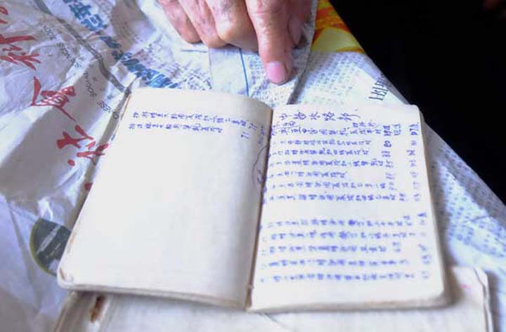 A book belonging to Chinese fisherman Su Chengfen depicts sailing routes from Tanmen county in Hainan province to Huangyan Island in the South China Sea. LIU XIAOLI  CHINA DAILY