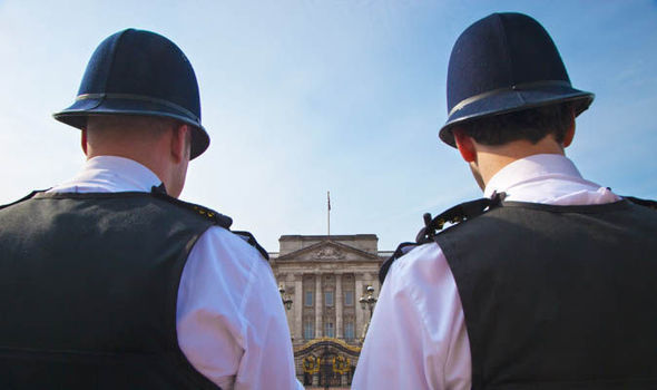 Two police officers outside the palace