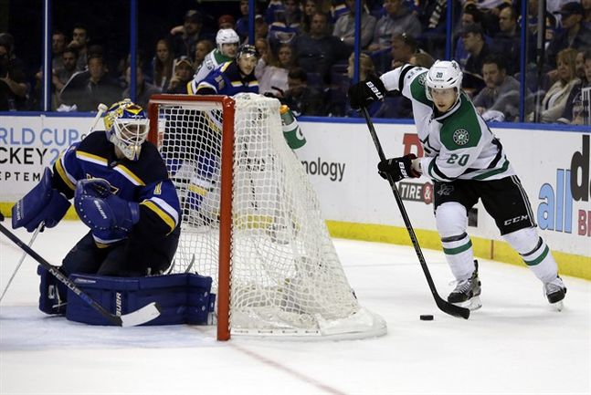 Dallas Stars Cody Eakin right looks to pass as St. Louis Blues goalie Brian Elliott defends during the third period of Game 4 of the NHL hockey Stanley Cup Western Conference semifinals Thursday