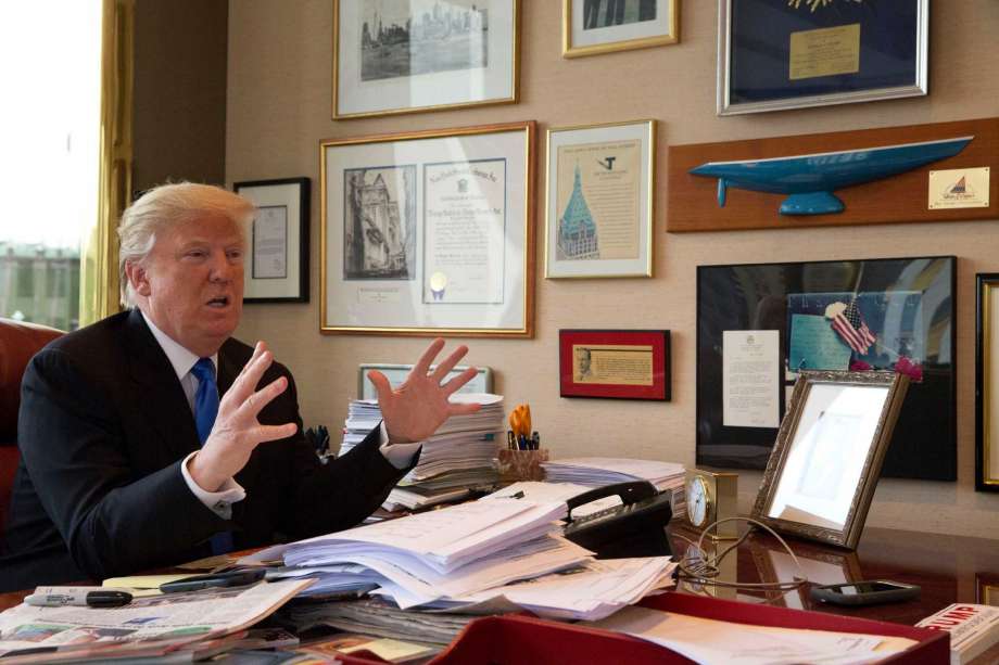 Republican presidential candidate Donald Trump gestures as he speaks during an interview with The Associated Press in his office at Trump Tower in New York Tuesday