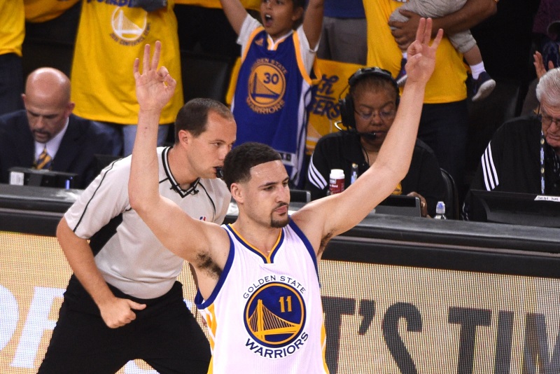 Golden State guard Klay Thompson celebrates after hitting a three-point shot during the Warriors&#039 win over the Trail Blazers