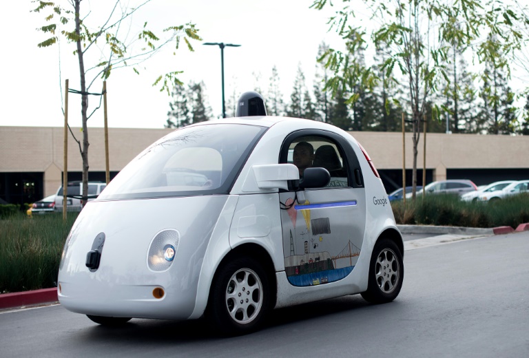 AFP  File  Noah Berger Google has announced plans for a new center in Novi Michigan that will house engineers and others testing vehicles for its self-driving car program