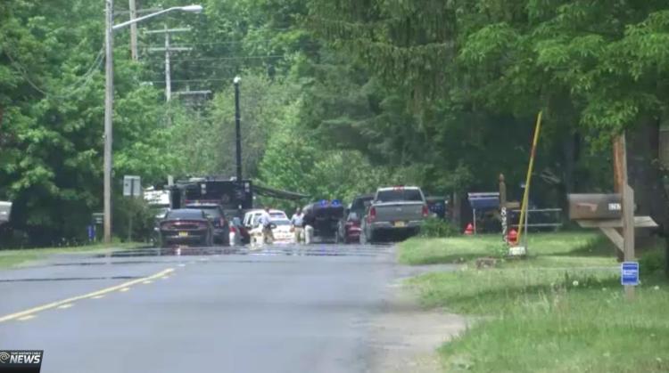 Authorities investigate the scene of a suspicious package that exploded Sunday injuring a New York State correction officer in Floyd N.Y