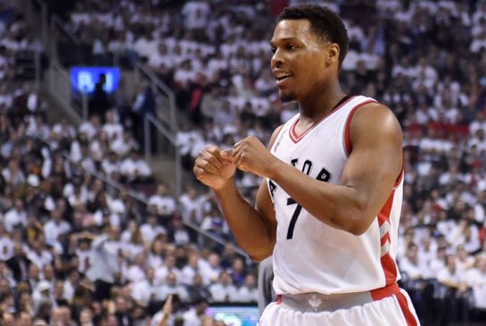 Toronto Raptors Kyle Lowry clebrates after making a basket against the Miami Heat during first half NBA playoff basketball action in Toronto on Thursday