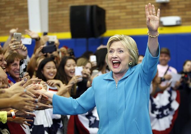 Democratic presidential candidate Hillary Clinton reacts as she arrives at a rally at the University of California Riverside Tuesday