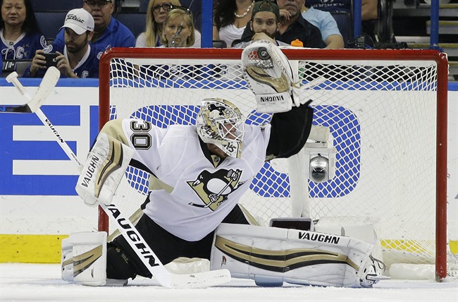 Pittsburgh Penguins goalie Matt Murray makes a glove save on a shot by the Tampa Bay Lightning during the third period of Game 3 of the NHL hockey Stanley Cup Eastern Conference Finals Wednesday