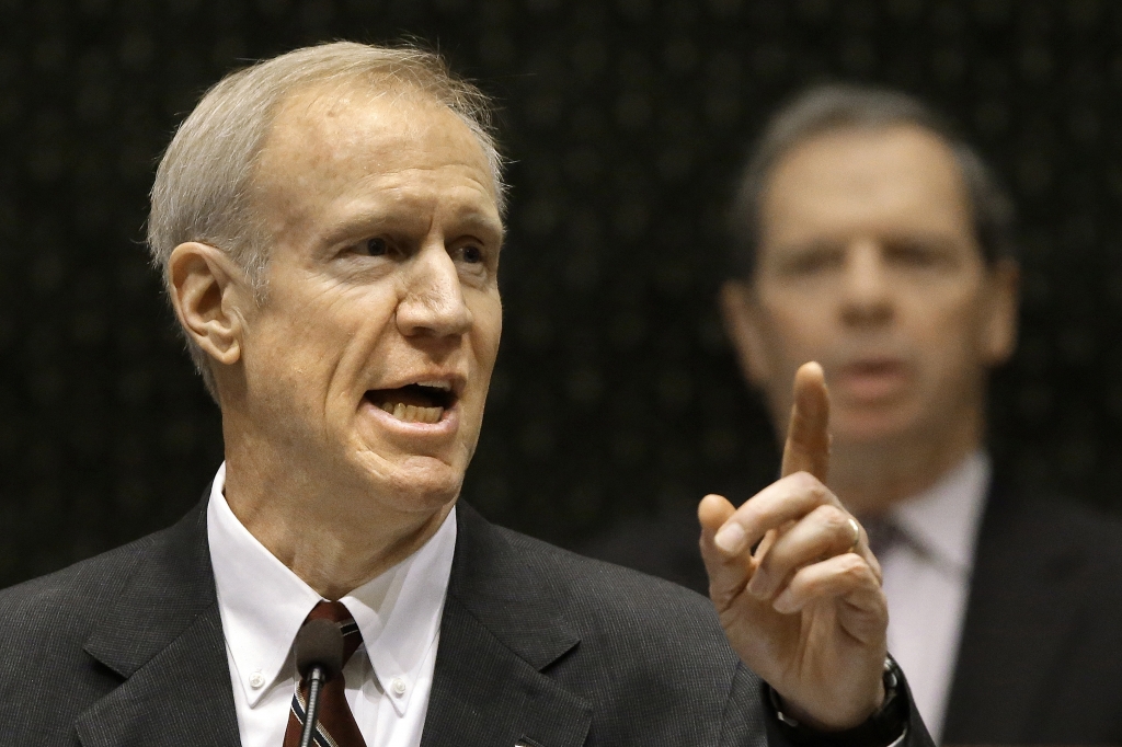 Illinois Gov. Bruce Rauner signed a bill to fund Illinois universities through the fall. | Associated Press file