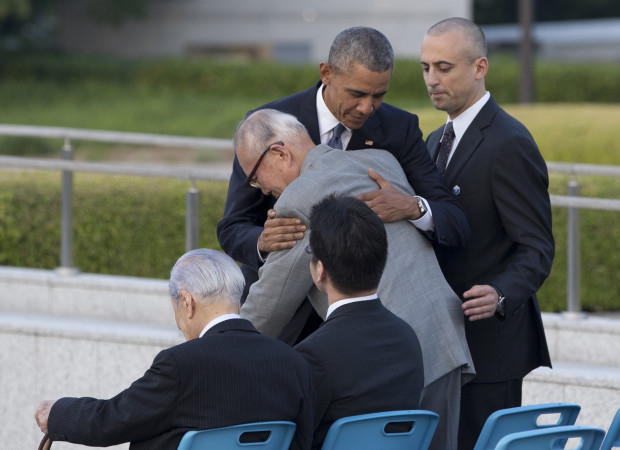 U.S. President Barack Obama hugs Shigeaki Mori an atomic bomb survivor creator of the memorial for American WWII POWs killed at Hiroshima during a ceremony at Hiroshima Peace Memorial Park in Hiroshima western Japan Friday May 27