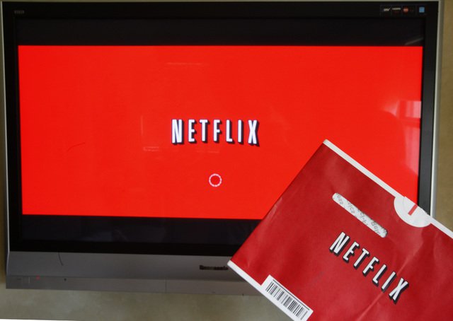 Netflix DVD envelope and Netflix on-screen television menu are shown in Surfside Fla. AP