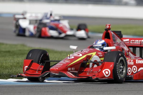 Scott Dixon of New Zealand steers his car