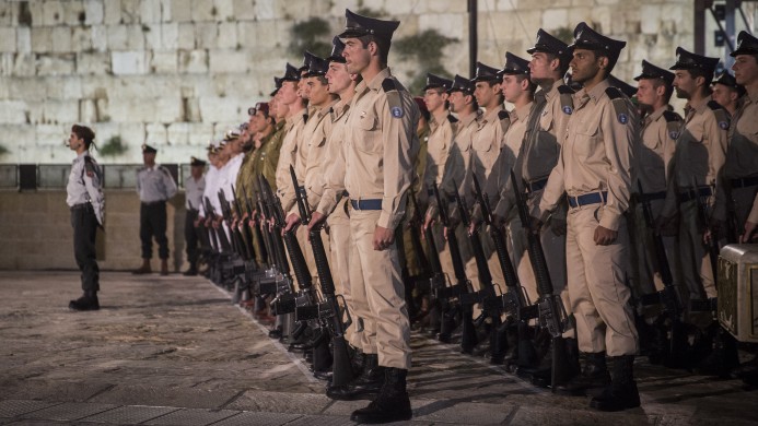 Israeli soldiers stand guard during a Memorial Day ceremony at the Western Wall Judaism's holiest site in Jerusalem's Old City