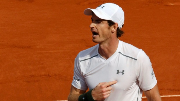 Andy Murray points to his heart as he celebrates his second-round victory over Mathias Bourgue at the French Open