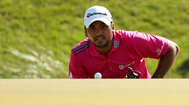 Jason Day of Australia lines up a putt on the 11th green during the final round of THE PLAYERS Championship at the Stadium course at TPC Sawgrass