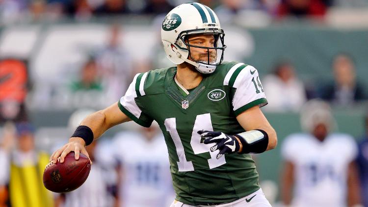 New York Jets quarterback Ryan Fitzpatrick drops back to pass against the Tennessee Titans during the third quarter at Met Life Stadium. The Jets defeated the Titans 30-8