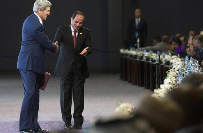 John Kerry is greeted by Abdel Fattah al Sisi during the Egypt Economic Development