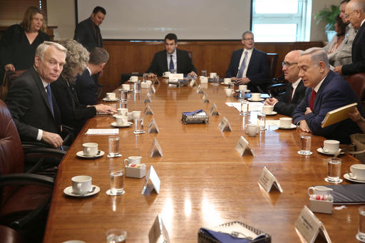 Israeli Prime Minister Benjamin Netanyahu right meets with French Foreign Minister Jean Marc Ayrault left at the Prime Minister's office in Jerusalem Sunday