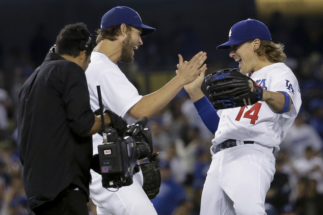 Los Angeles Dodgers starting pitcher Clayton Kershaw and third baseman Enrique Hernandez right celebrate after the Dodgers 5-0 win over the New York Mets