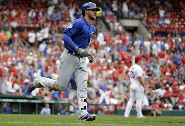 Chicago Cubs Kris Bryant left rounds the bases after hitting a three-run home run off St. Louis Cardinals relief pitcher Seung Hwan Oh right during the