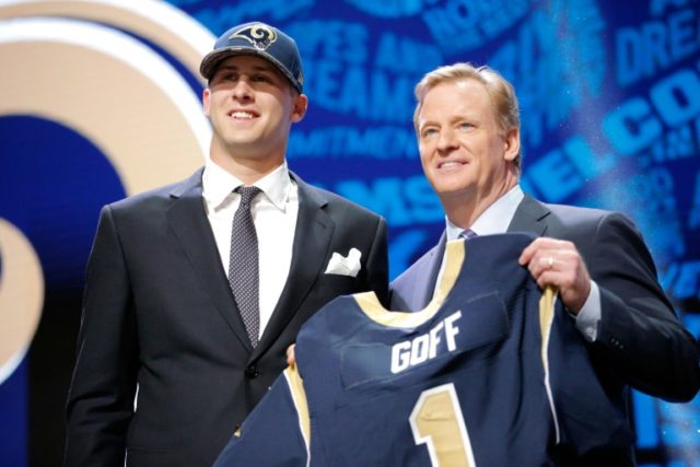 Jared Goff stands next to NFL Commissioner Roger Goodell after being picked number one overall by the Los Angeles Rams during the 2016 NFL Draft