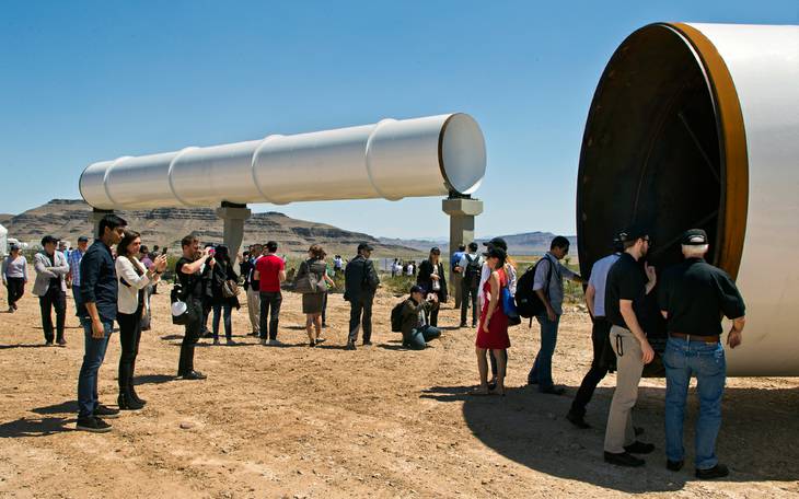 L.E. Baskow Guests and media check out several tubes after a Hyperloop One sled test Wednesday