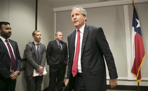 Republican Texas Attorney General Ken Paxton walks away after announcing Texas lawsuit to challenge President Obama's transgender bathroom order during a news conference in Austin Texas Wednesday