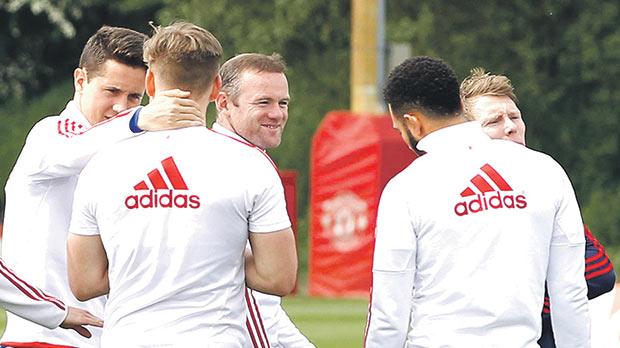 Ander Herrera talks to Luke Shaw during training yesterday