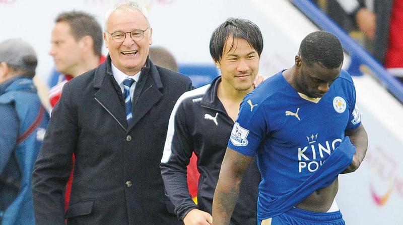 Leicester manager Claudio Ranieri with Shinji Okazaki and Wes Morgan