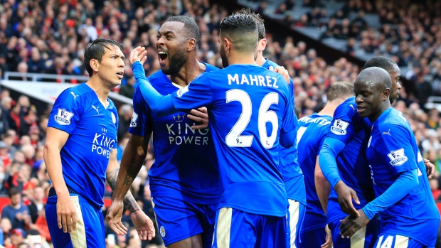 Leicester's Wes Morgan second left celebrates with teammates after scoring during the English Premier League soccer match between Manchester United and Leicester at Old Trafford Stadium Manchester England on Sunday