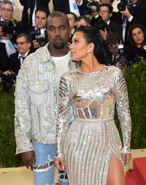 Kanye West left and Kim Kardashian arrive at The Metropolitan Museum of Art Costume Institute Benefit Gala celebrating the opening