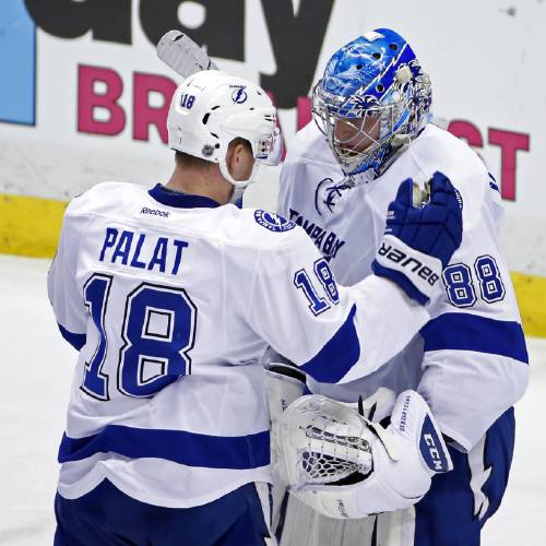 Lightning goalie Andrei Vasilevskiy celebrates with Ondrej Palat after the Lightning's 3-1 win over the Pittsburgh Penguins in Game 1 of the NHL hockey Stanley Cup Eastern Conference finals Friday