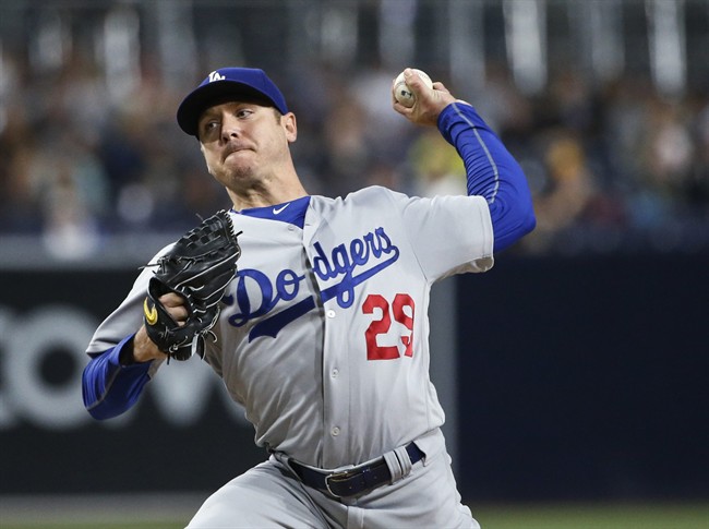 Los Angeles Dodgers starting pitcher Scott Kazmir works against the San Diego Padres in the first inning of a baseball game Friday