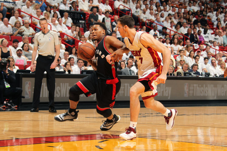 Kyle Lowry driving on the Heat’s Goran Dragic hits shots including 3-pointers in a 33-point performance for the Raptors