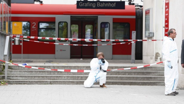 One man dead after attacker heard shouting 'Allahu Akbar' knifes Munich rail passengers