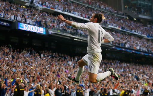 Real Madrid's Gareth Bale celebrates after scoring the opening goal during the Champions League semifinal second leg soccer match between Real Madrid and Manchester City at the Santiago Bernabeu stadium in Madrid Wednesday M