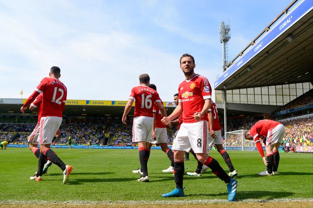 Juan Mata of Manchester United celebrates scoring his team's first goal during the Barclays Premier League match between Norwich City and Manchester United at Carrow Road