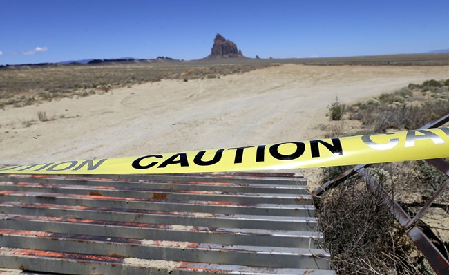 An access road to the Shiprock pinnacle is taped off along Navajo Route 13 just a few miles from where Ashlynne Mike's body was discovered in south of Shiprock N.M. on Tuesday