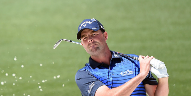 Marc Leishman plays a shot from a bunker during the 2016 Masters Tournament