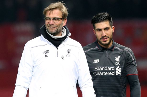 Jurgen Klopp celebrates with Emre Can after the match