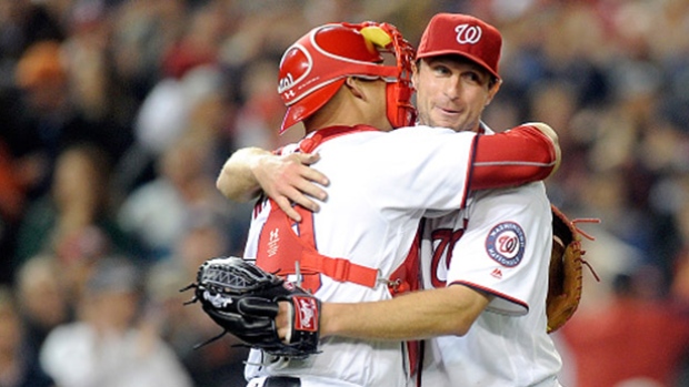 Nationals pitcher Max Scherzer right embraces catcher Wilson Ramos after his record-tying 20-strikeout performance Wednesday in Washington